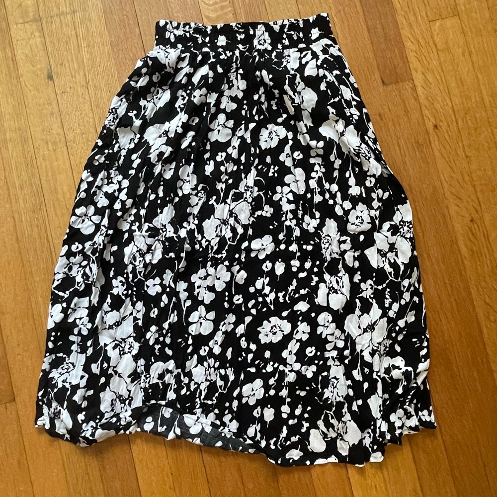 I am selling a black and white skirt with flower design all around